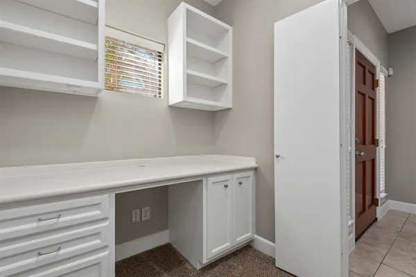a hallway with cabinets