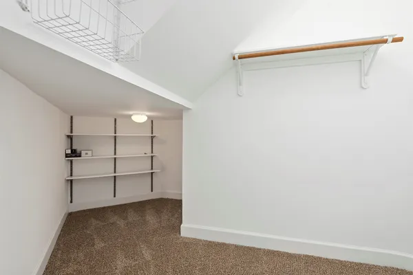 a view of an empty walk in closet