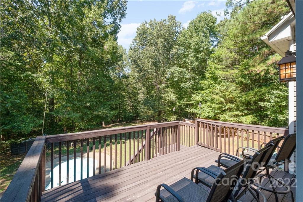 5712 Davis Road Waxhaw, NC 28173 - Photo 25 of 43 a view of a balcony with wooden floor and outdoor space