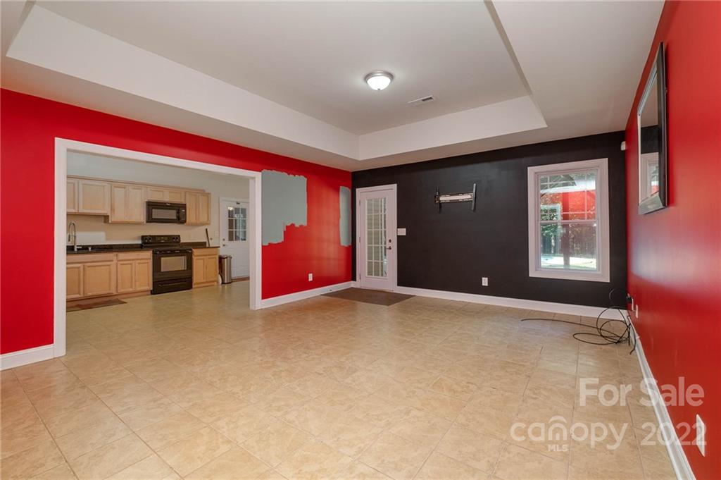 5712 Davis Road Waxhaw, NC 28173 - Photo 29 of 43 a view of empty room with furniture and kitchen view