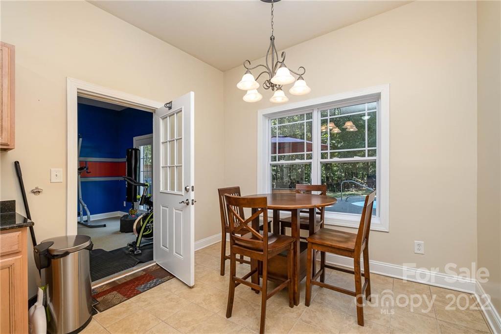 5712 Davis Road Waxhaw, NC 28173 - Photo 34 of 43 a view of a dining room with furniture window and outside view