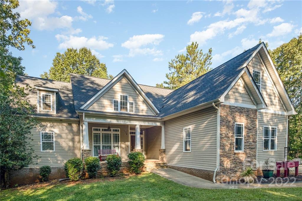 5712 Davis Road Waxhaw, NC 28173 - Photo 5 of 43 a front view of a house with garden