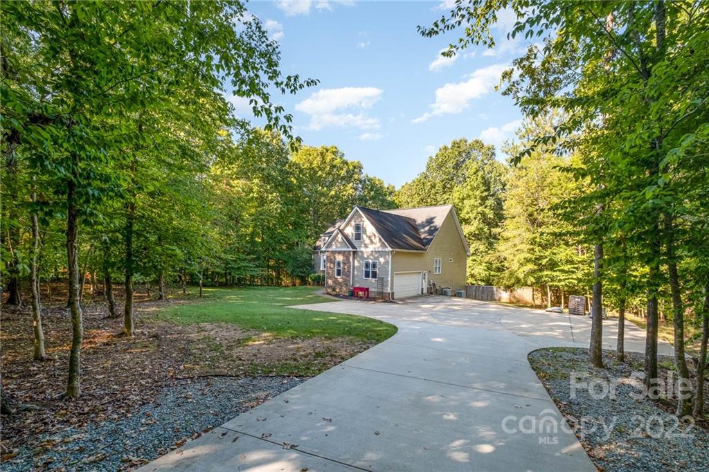5712 Davis Road Waxhaw, NC 28173 - Photo 6 of 43 a front view of a house with a yard and garage
