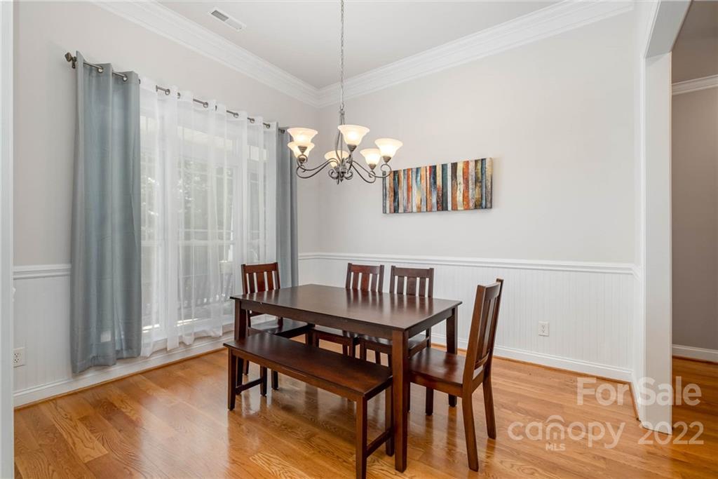 5712 Davis Road Waxhaw, NC 28173 - Photo 8 of 43 a view of a dining room with furniture and wooden floor