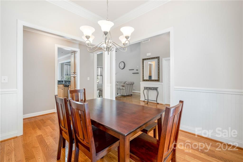 5712 Davis Road Waxhaw, NC 28173 - Photo 9 of 43 a view of a dining room with furniture and wooden floor