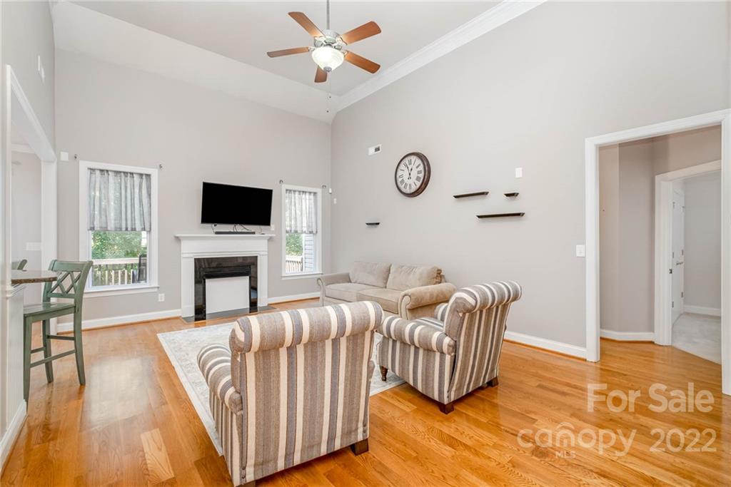 5712 Davis Road Waxhaw, NC 28173 - Photo 10 of 43 a living room with furniture fireplace and a flat screen tv