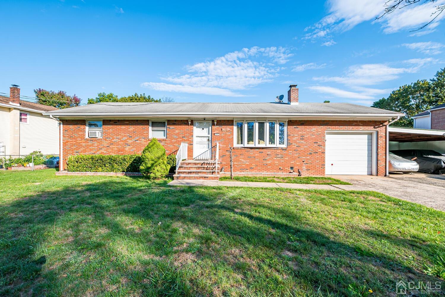 1037 Hamilton Street Somerset, NJ 08873 - Photo 1 of 29 a front view of house with yard and green space