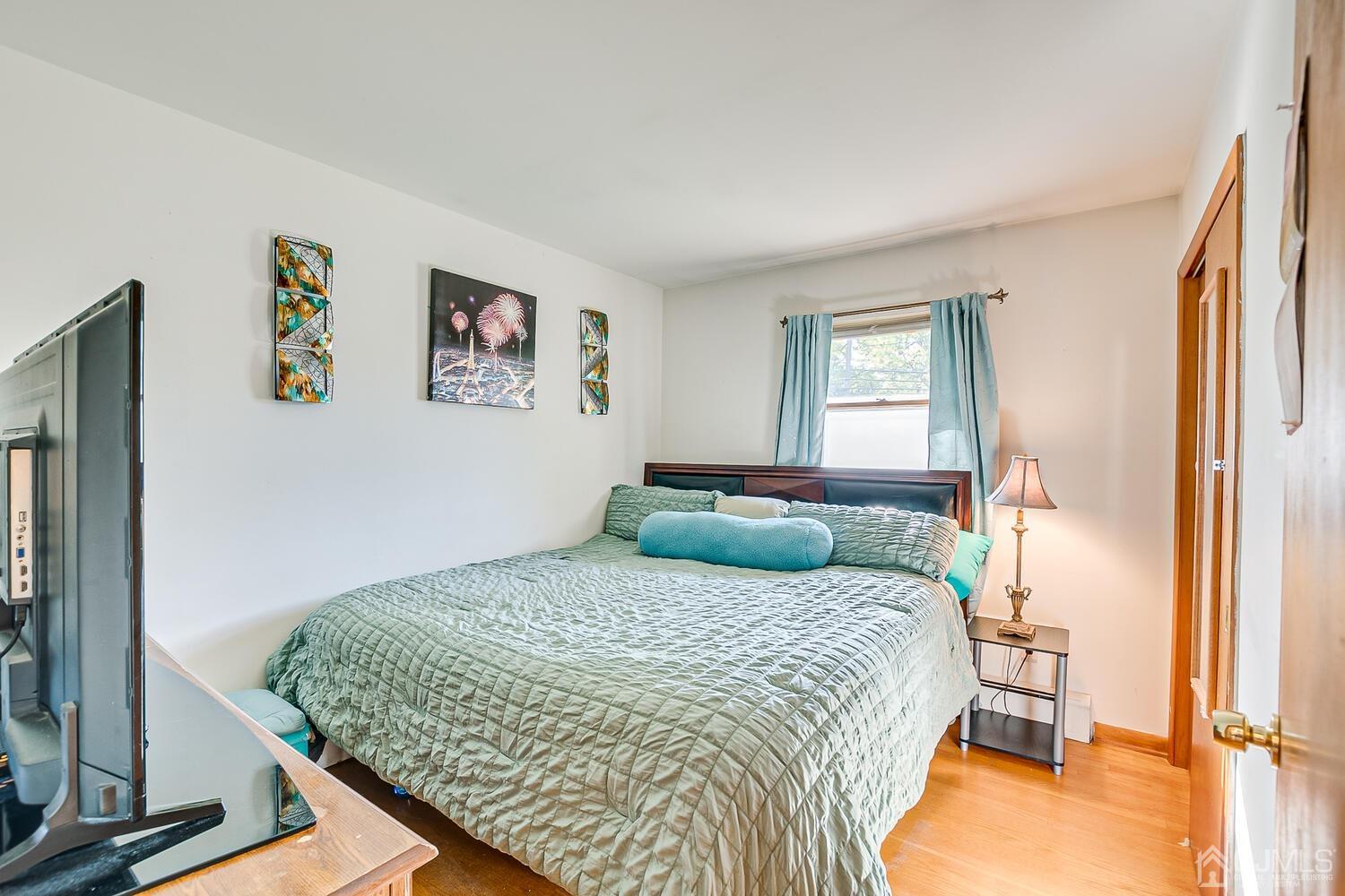 1037 Hamilton Street Somerset, NJ 08873 - Photo 18 of 29 a bedroom with a bed and a window