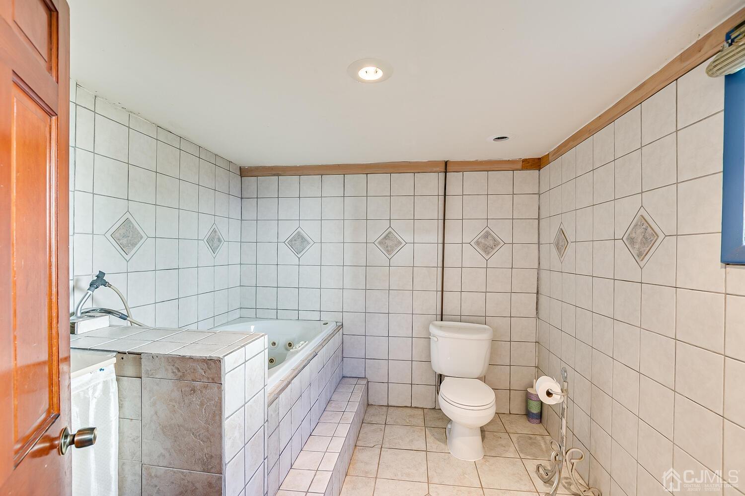1037 Hamilton Street Somerset, NJ 08873 - Photo 24 of 29 a bathroom with a toilet and a shower