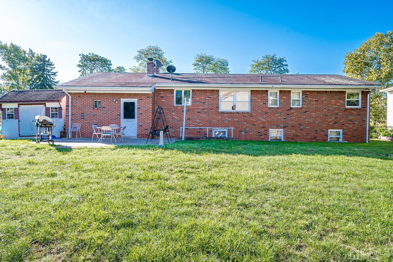 1037 Hamilton Street Somerset, NJ 08873 - Photo 26 of 29 a front view of a house with a yard and porch