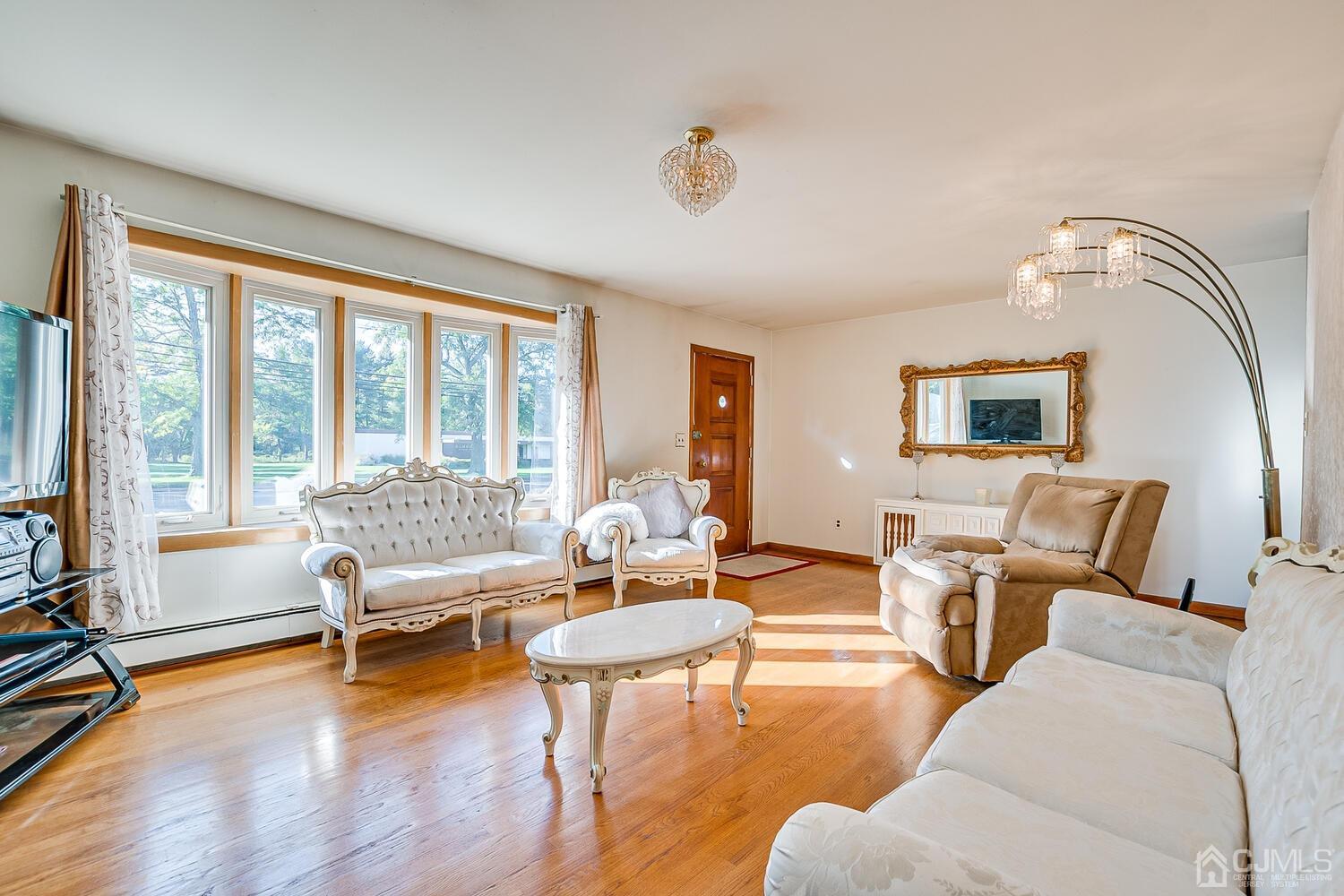 1037 Hamilton Street Somerset, NJ 08873 - Photo 7 of 29 a living room with furniture and a large window