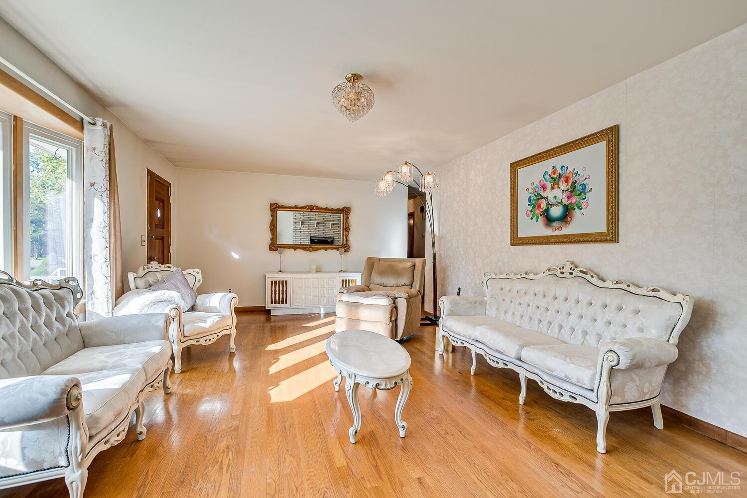 1037 Hamilton Street Somerset, NJ 08873 - Photo 8 of 29 a living room with furniture and a wooden floor