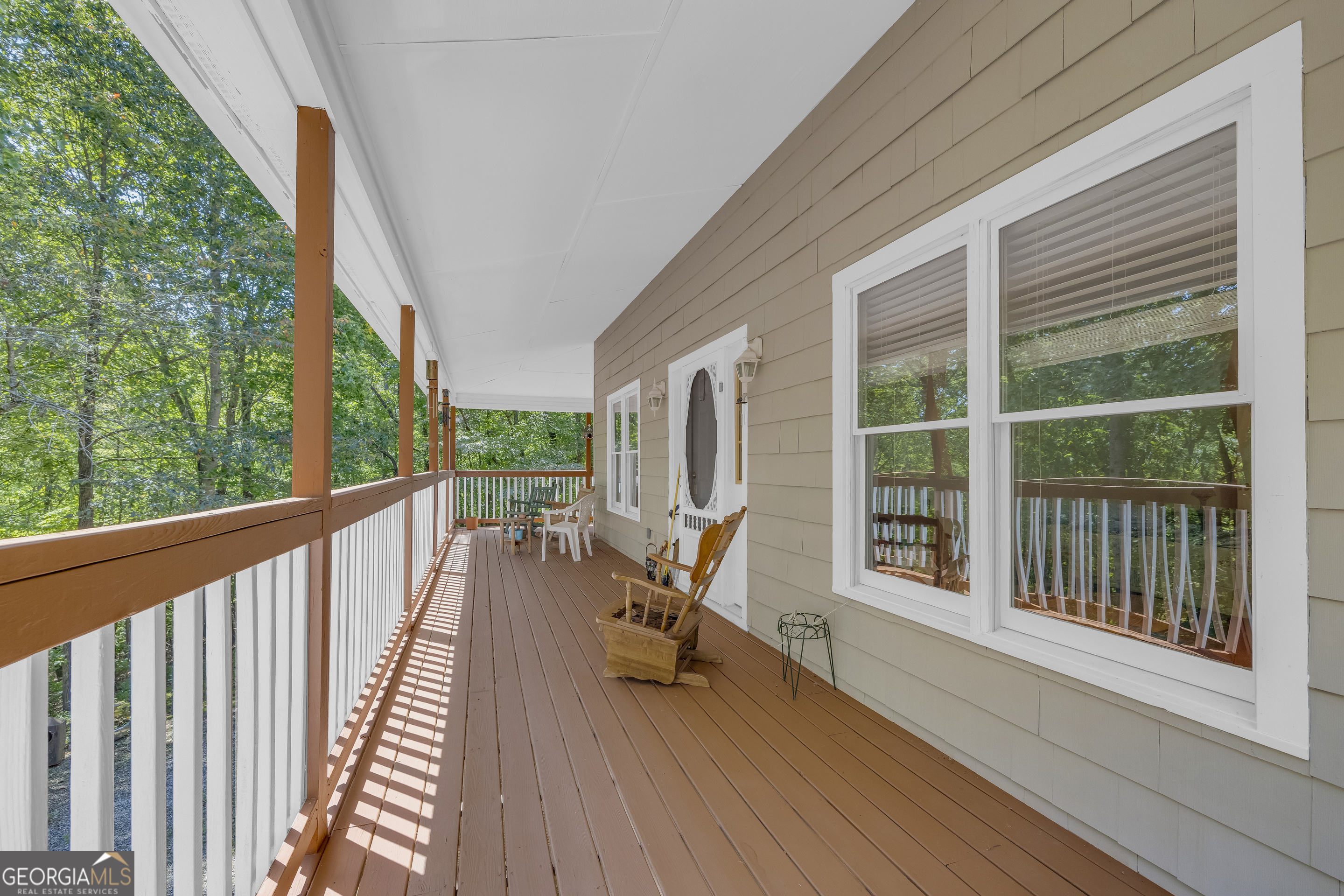 807 Satterfield Road Cleveland, GA 30528 - Photo 11 of 99 a view of balcony with chair and wooden floor
