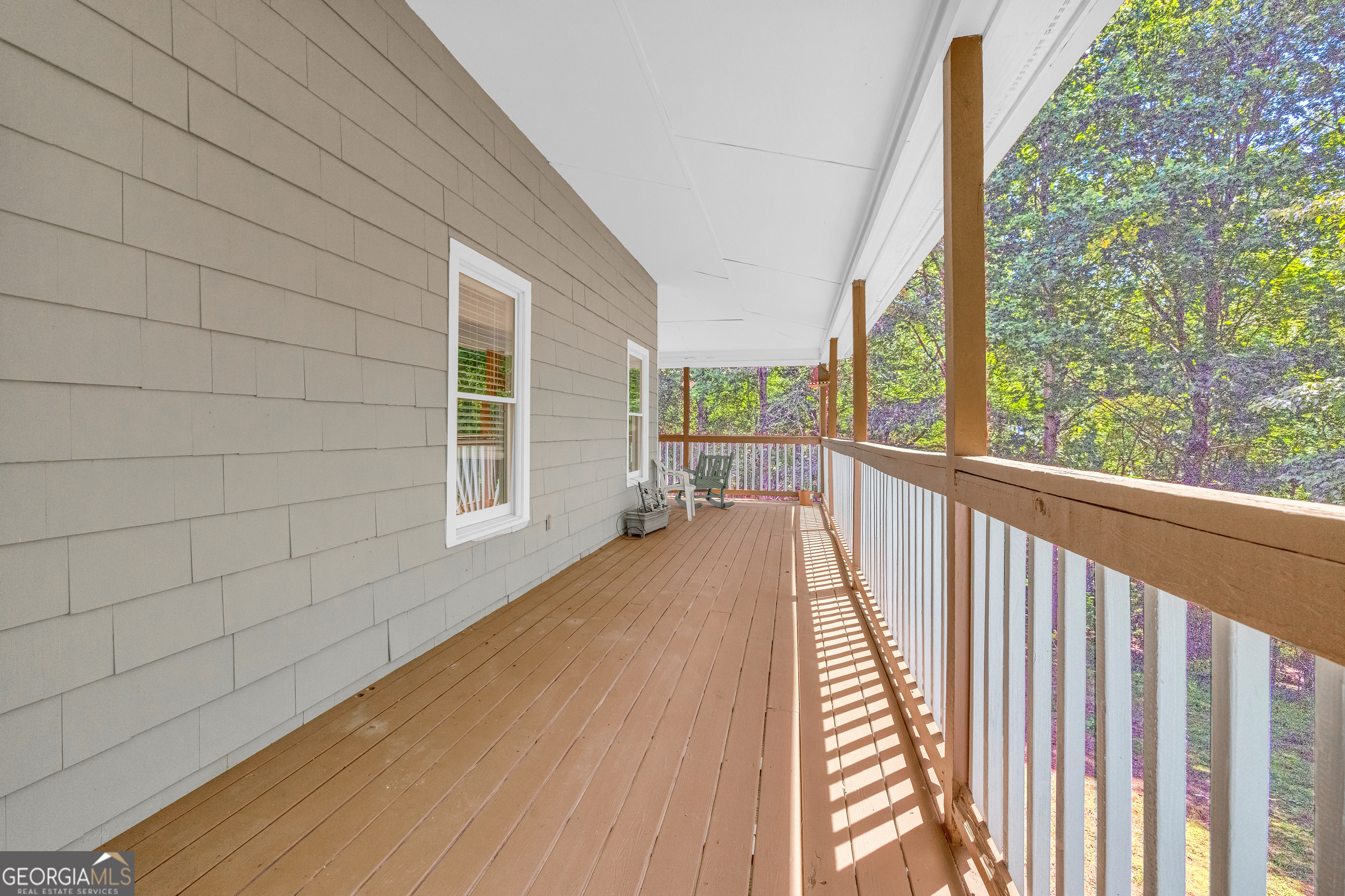 807 Satterfield Road Cleveland, GA 30528 - Photo 15 of 99 a view of a balcony with wooden floor and fence