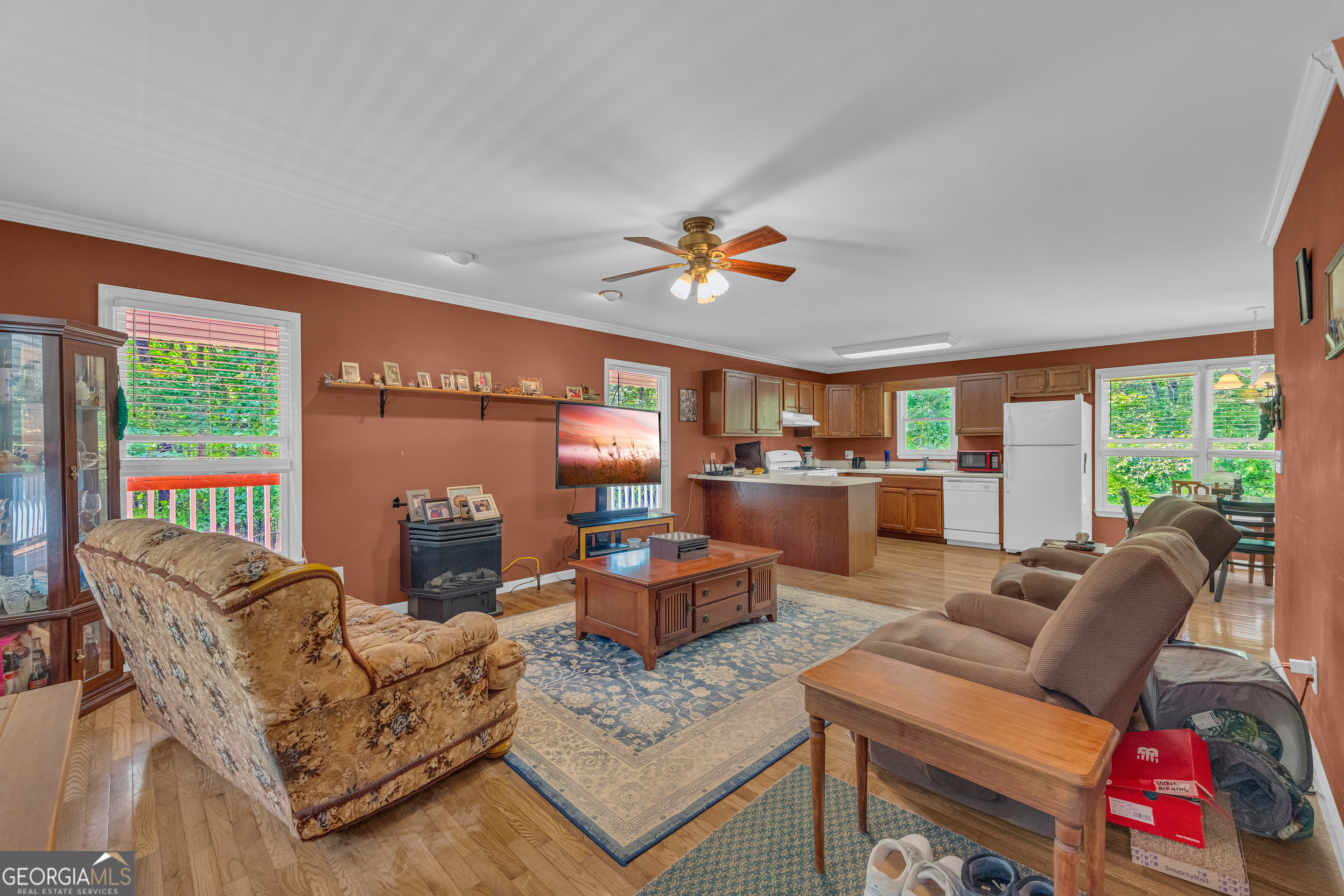 807 Satterfield Road Cleveland, GA 30528 - Photo 18 of 99 a living room with furniture ceiling fan and a large window