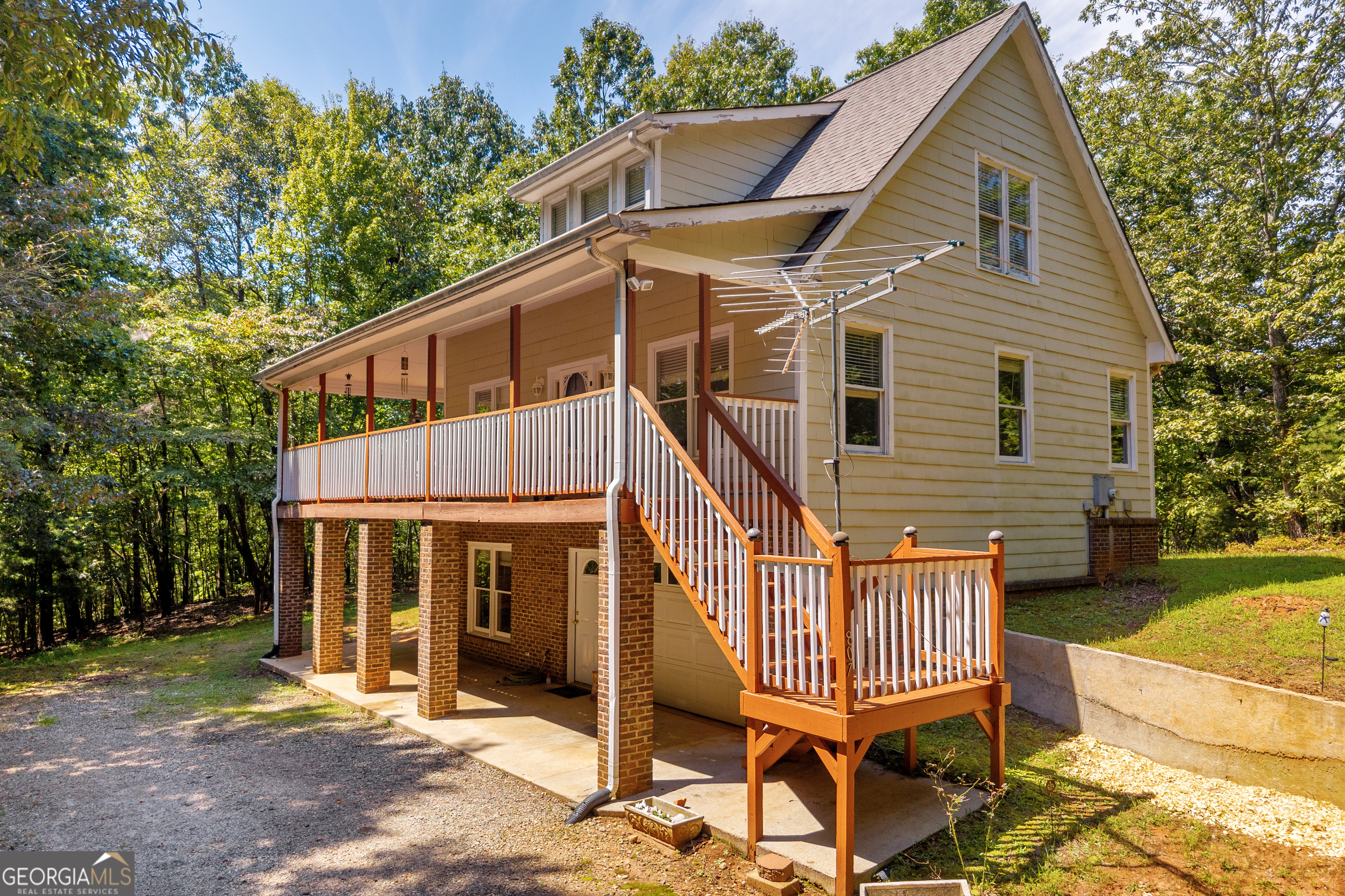 807 Satterfield Road Cleveland, GA 30528 - Photo 2 of 99 a front view of a house with a yard glass top table and chairs