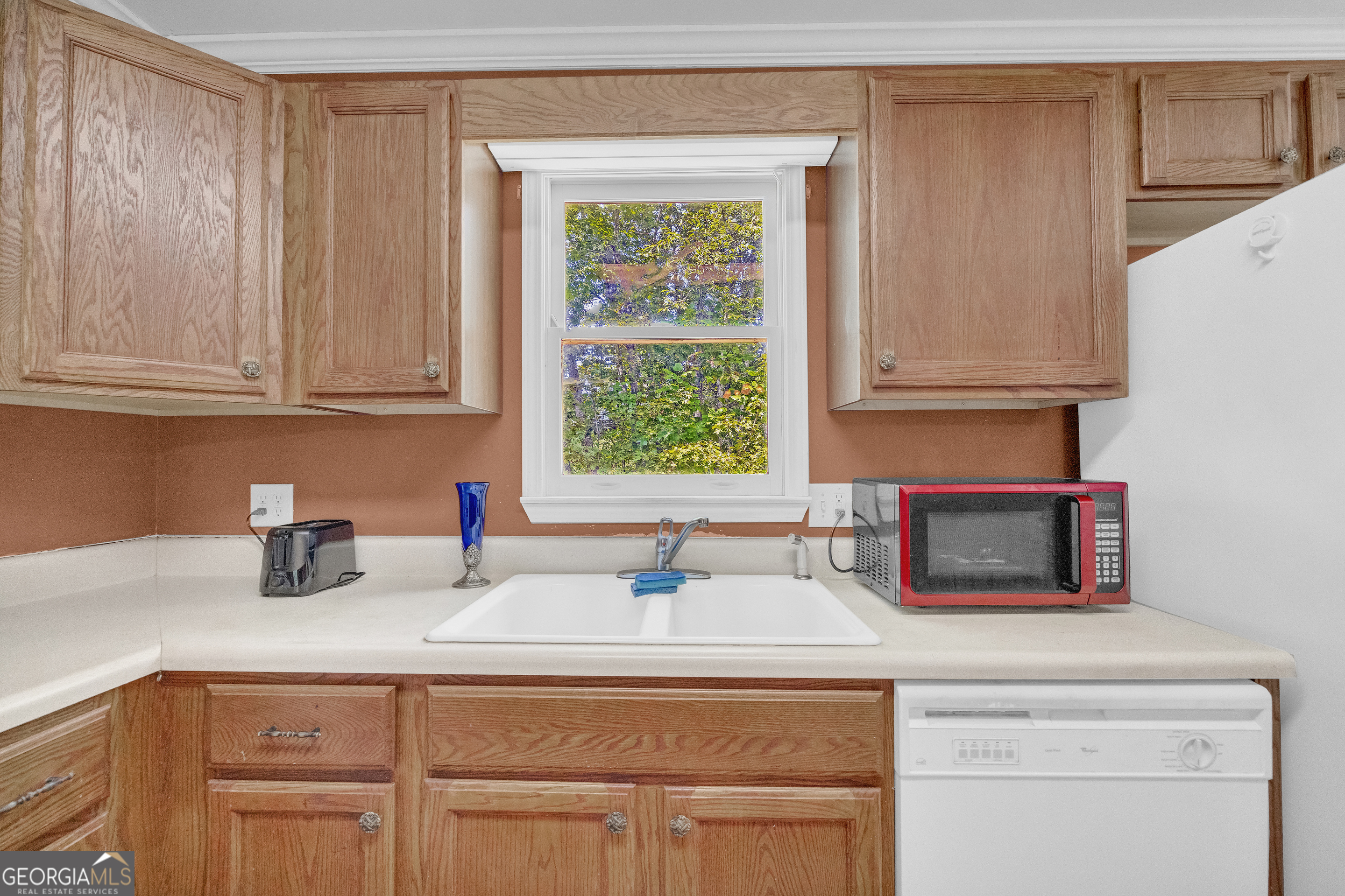 807 Satterfield Road Cleveland, GA 30528 - Photo 28 of 99 a kitchen with a sink cabinets and window