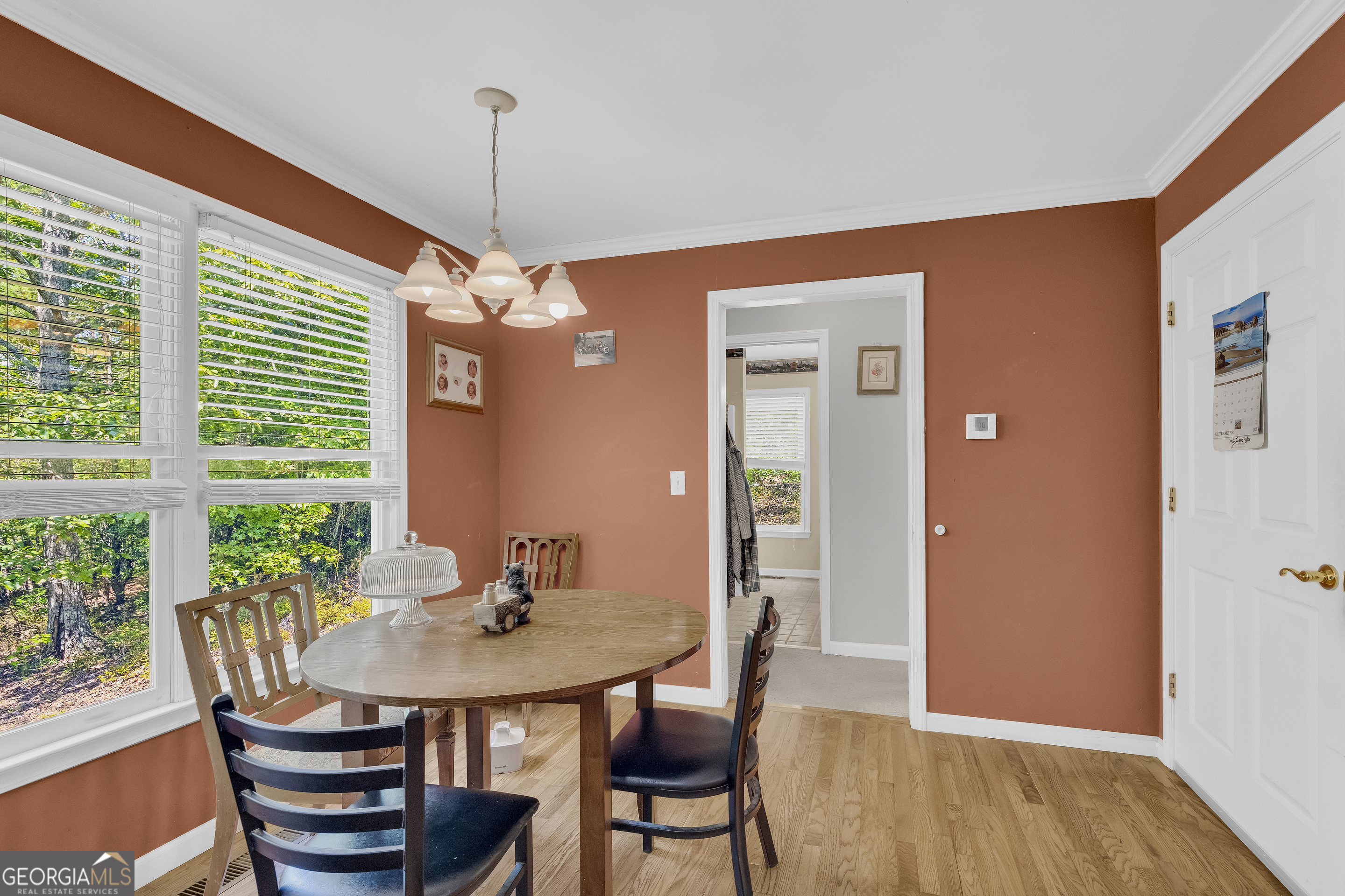 807 Satterfield Road Cleveland, GA 30528 - Photo 29 of 99 a view of a dining room with furniture window and wooden floor