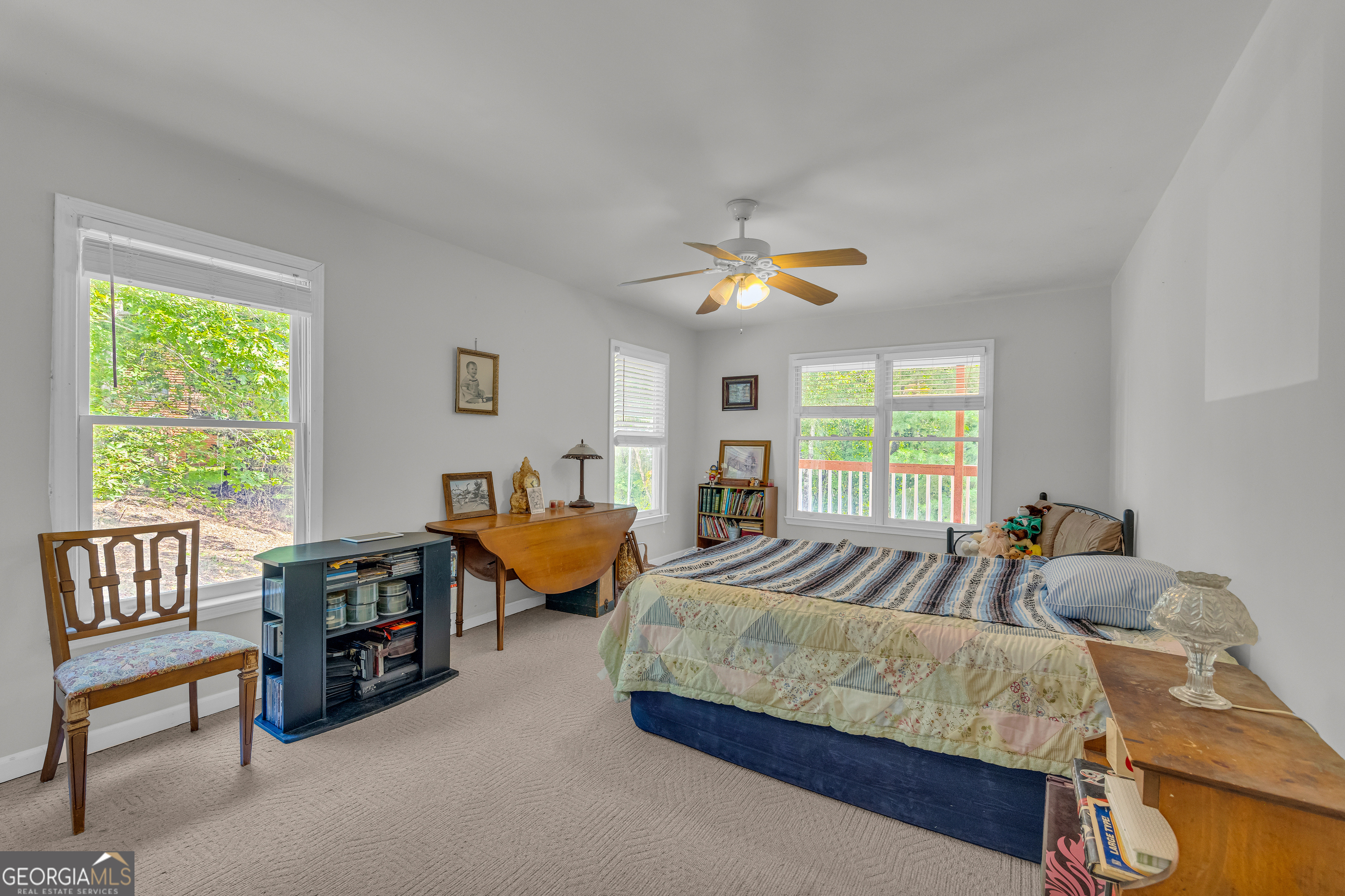 807 Satterfield Road Cleveland, GA 30528 - Photo 33 of 99 a spacious bedroom with a bed and a chandelier