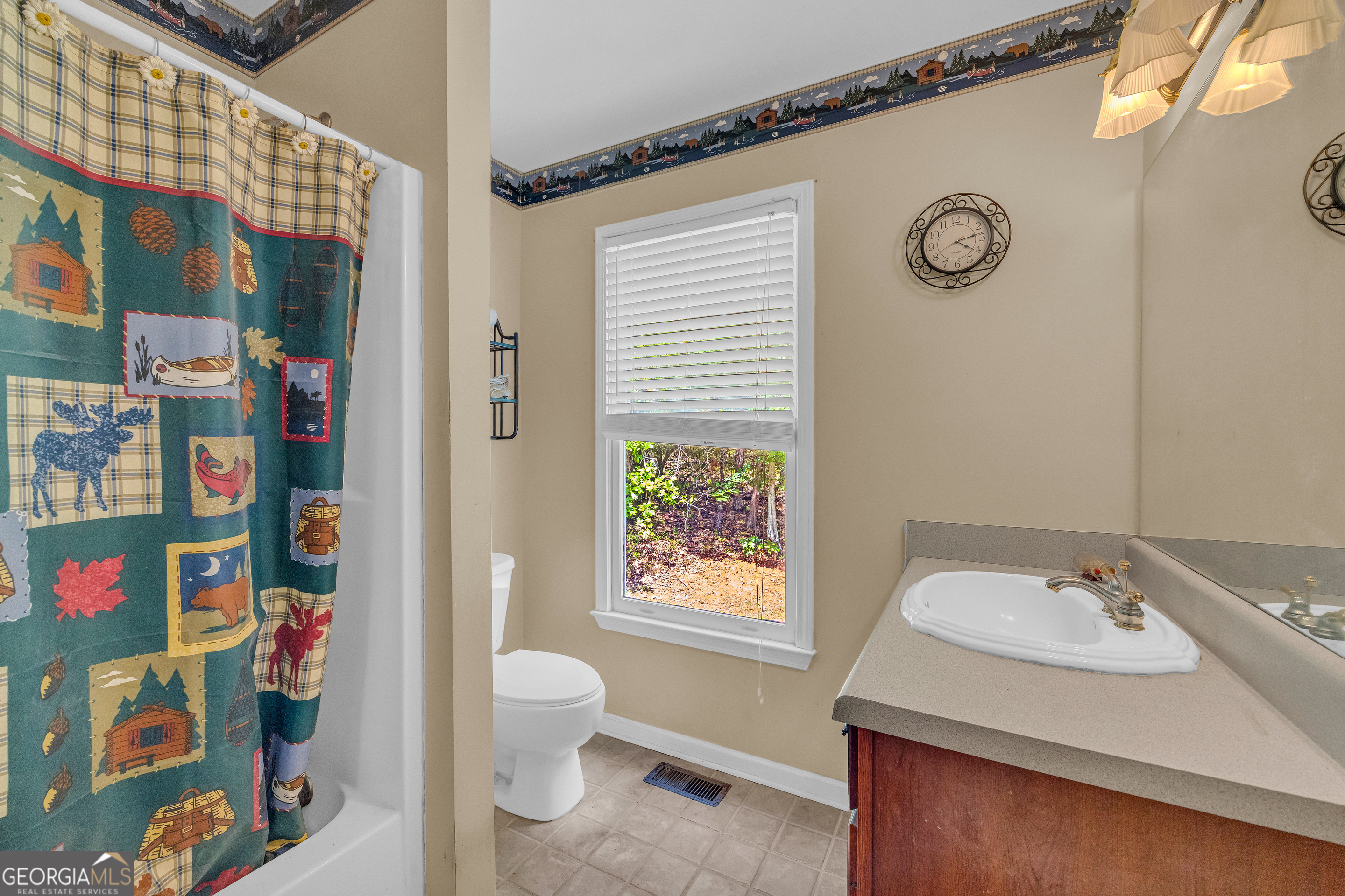 807 Satterfield Road Cleveland, GA 30528 - Photo 36 of 99 a bathroom with a sink and a toilet