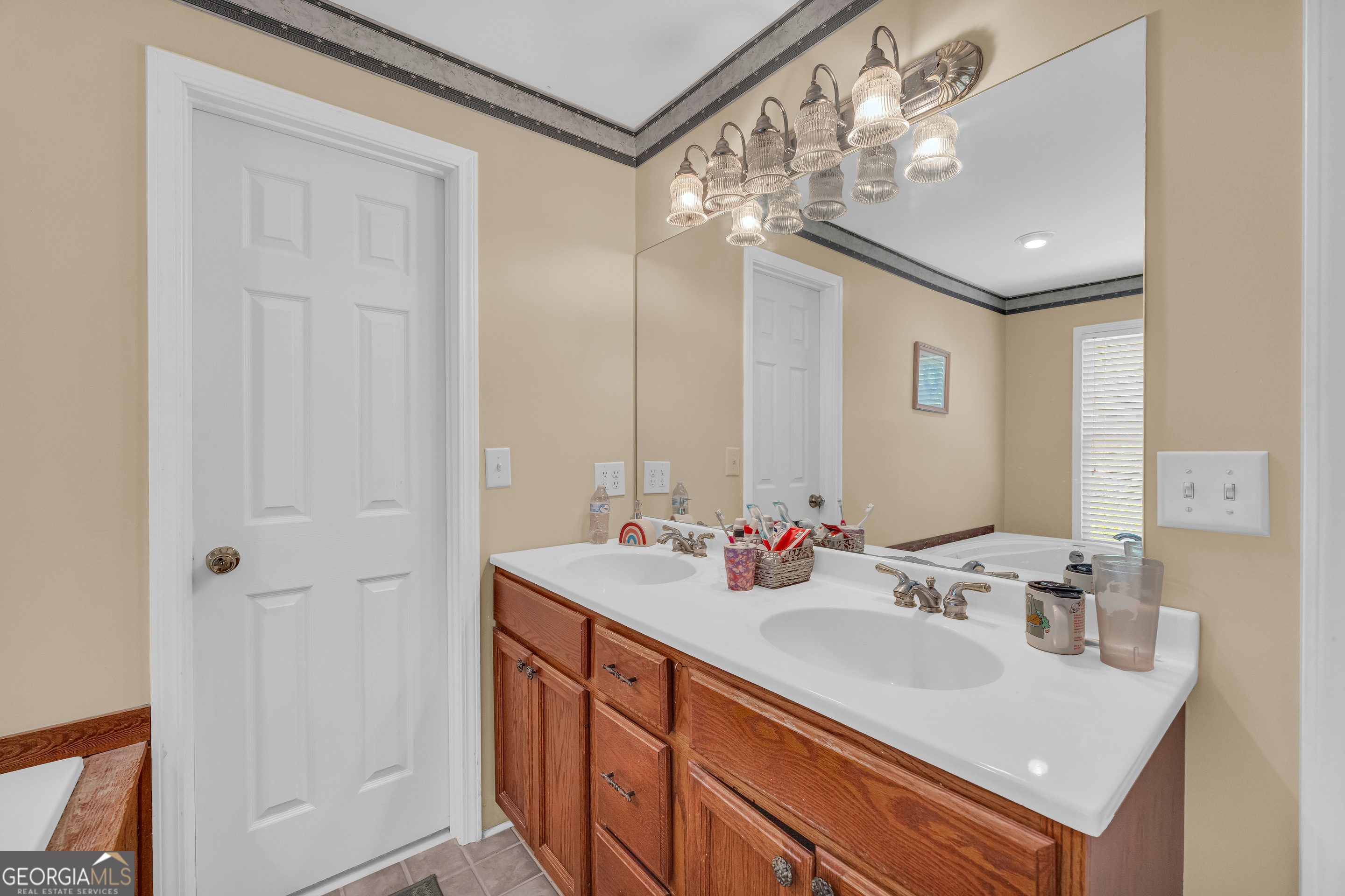807 Satterfield Road Cleveland, GA 30528 - Photo 49 of 99 a bathroom with a sink double vanity and a mirror