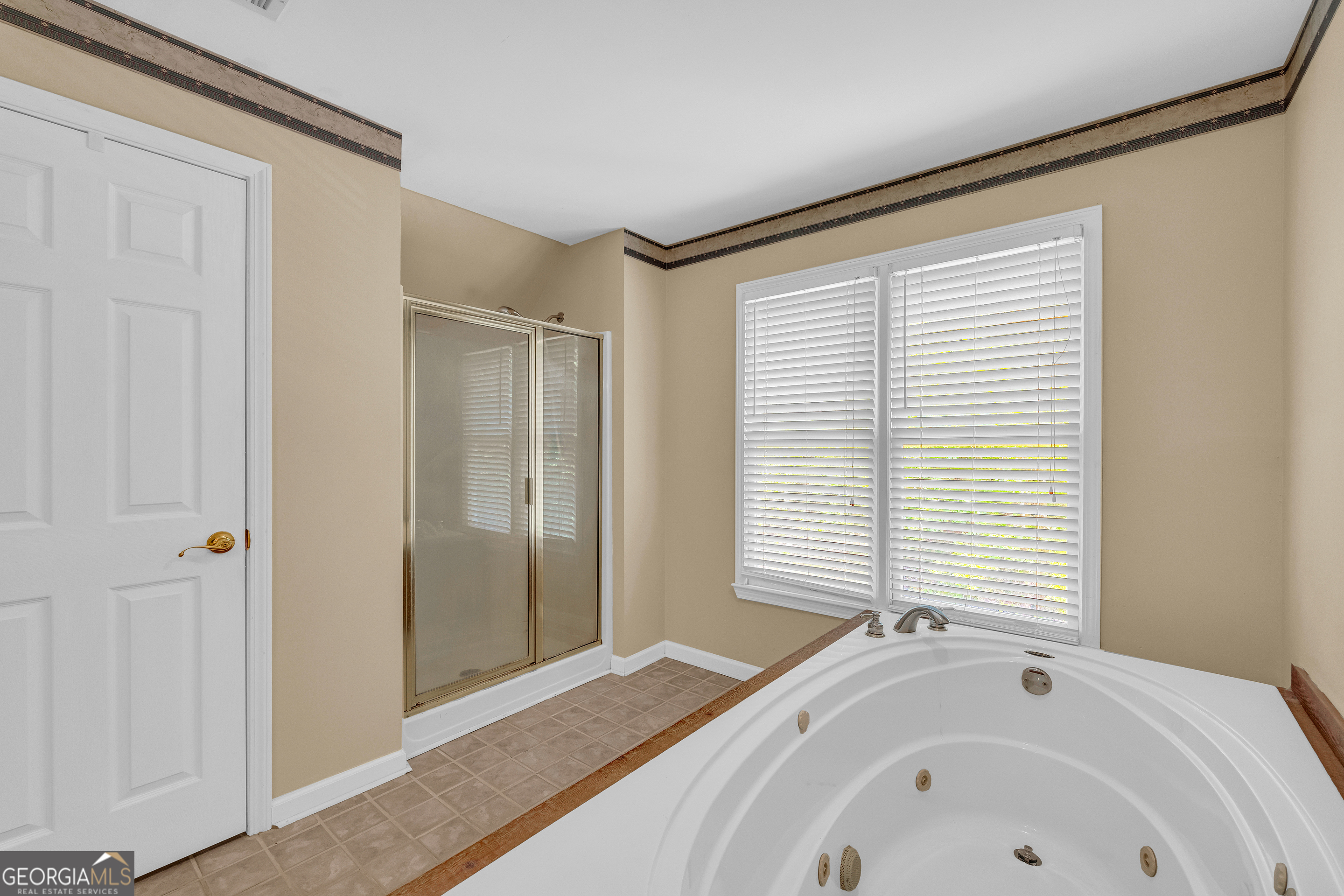 807 Satterfield Road Cleveland, GA 30528 - Photo 51 of 99 a bathroom with a bathtub and a shower