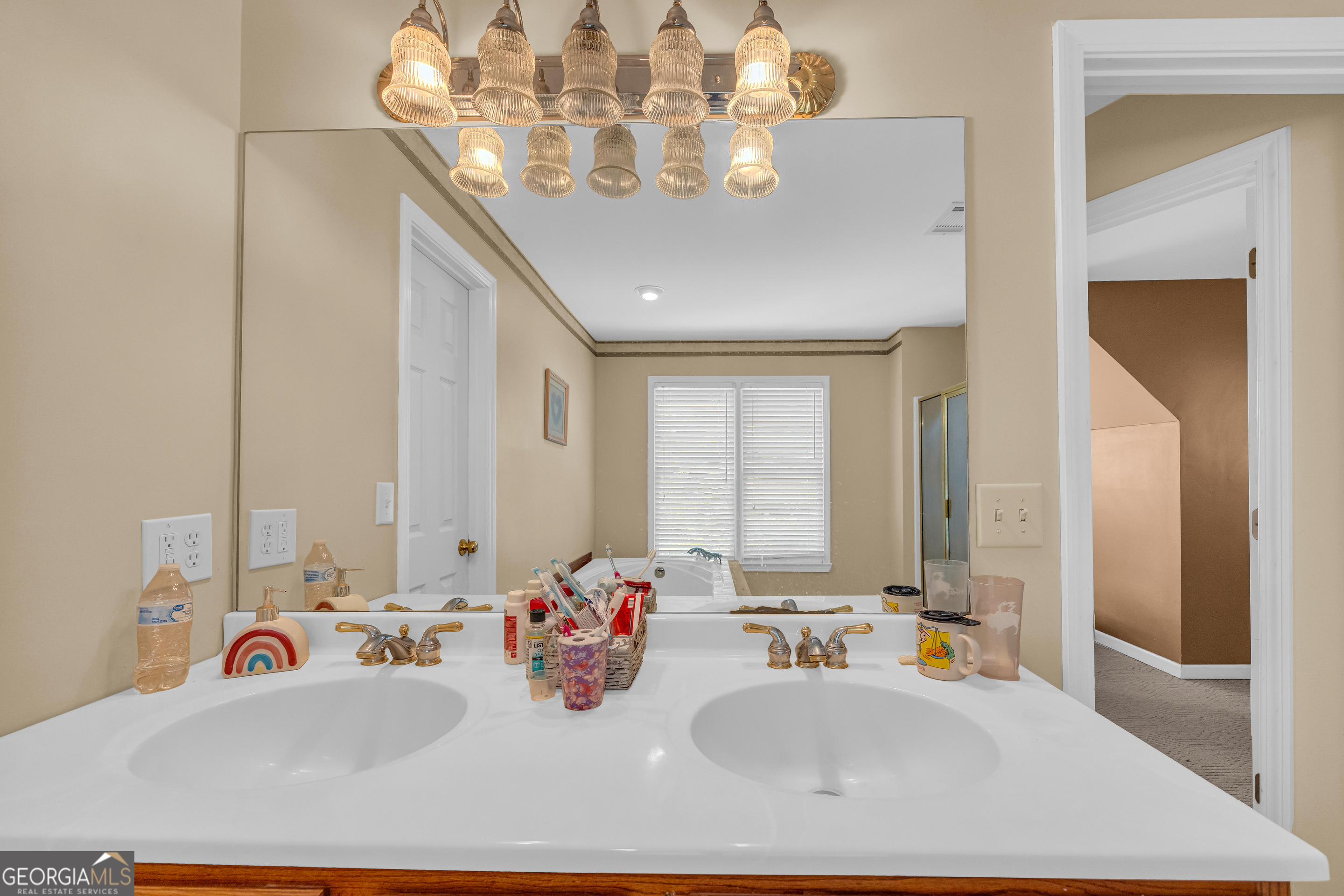 807 Satterfield Road Cleveland, GA 30528 - Photo 52 of 99 a bathroom with a double vanity sink and a mirror