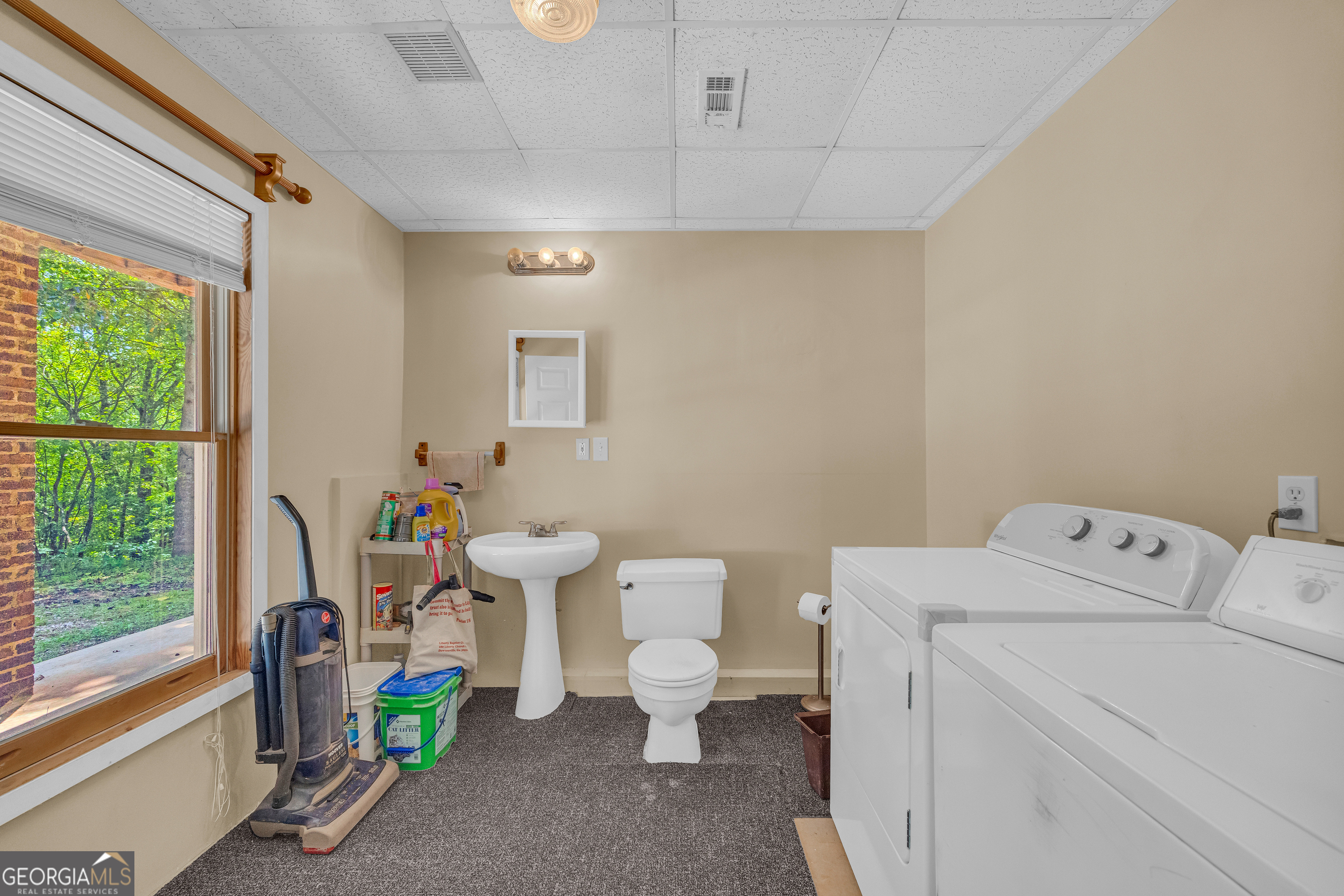 807 Satterfield Road Cleveland, GA 30528 - Photo 56 of 99 a bathroom with a toilet a sink and a window