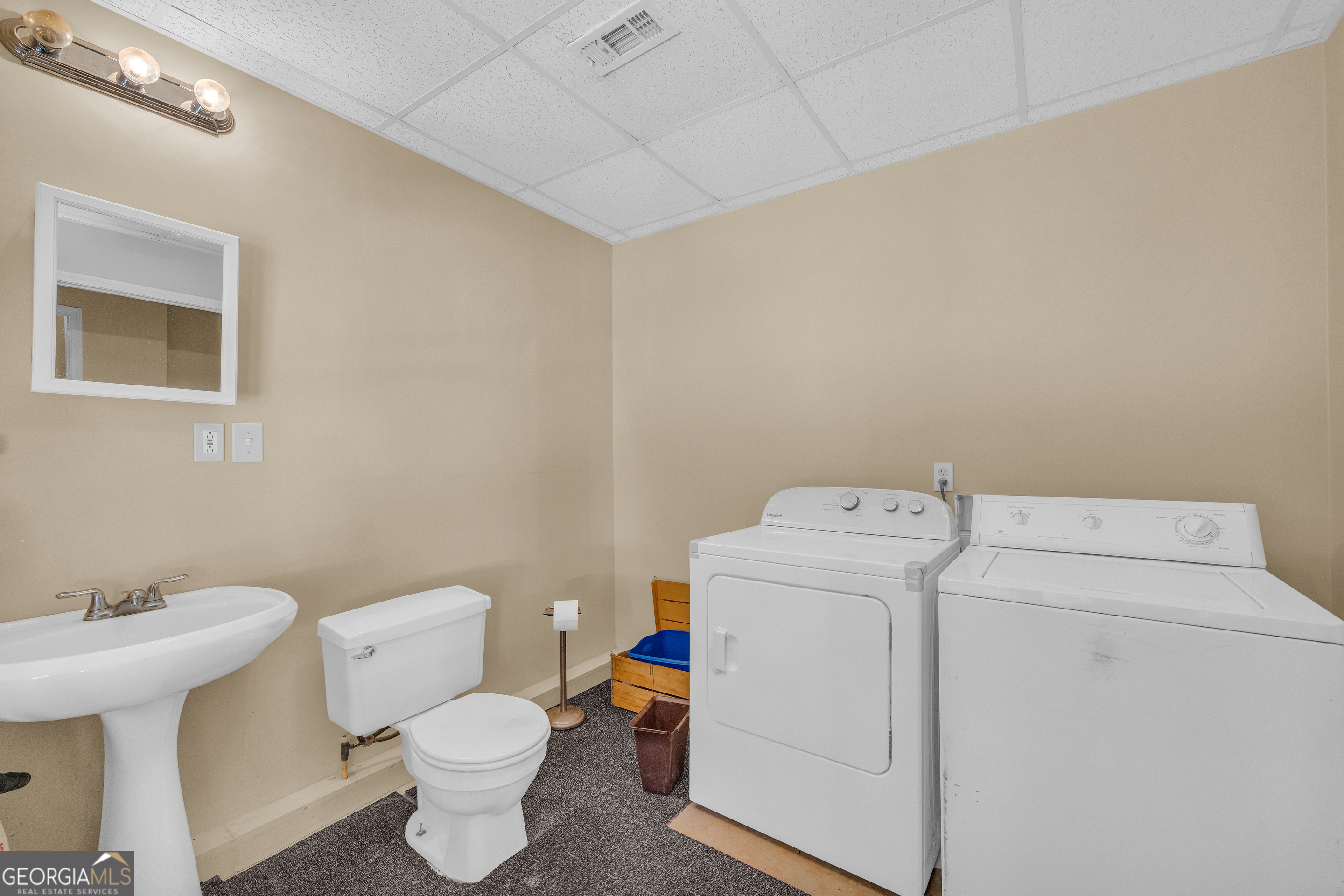 807 Satterfield Road Cleveland, GA 30528 - Photo 57 of 99 a white toilet sitting next to a bathroom sink