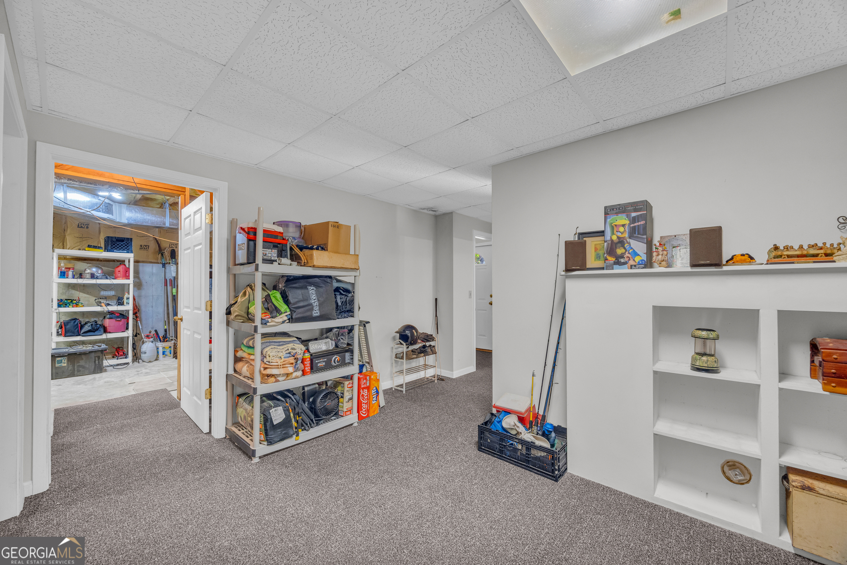 807 Satterfield Road Cleveland, GA 30528 - Photo 60 of 99 a room with furniture and a book shelf