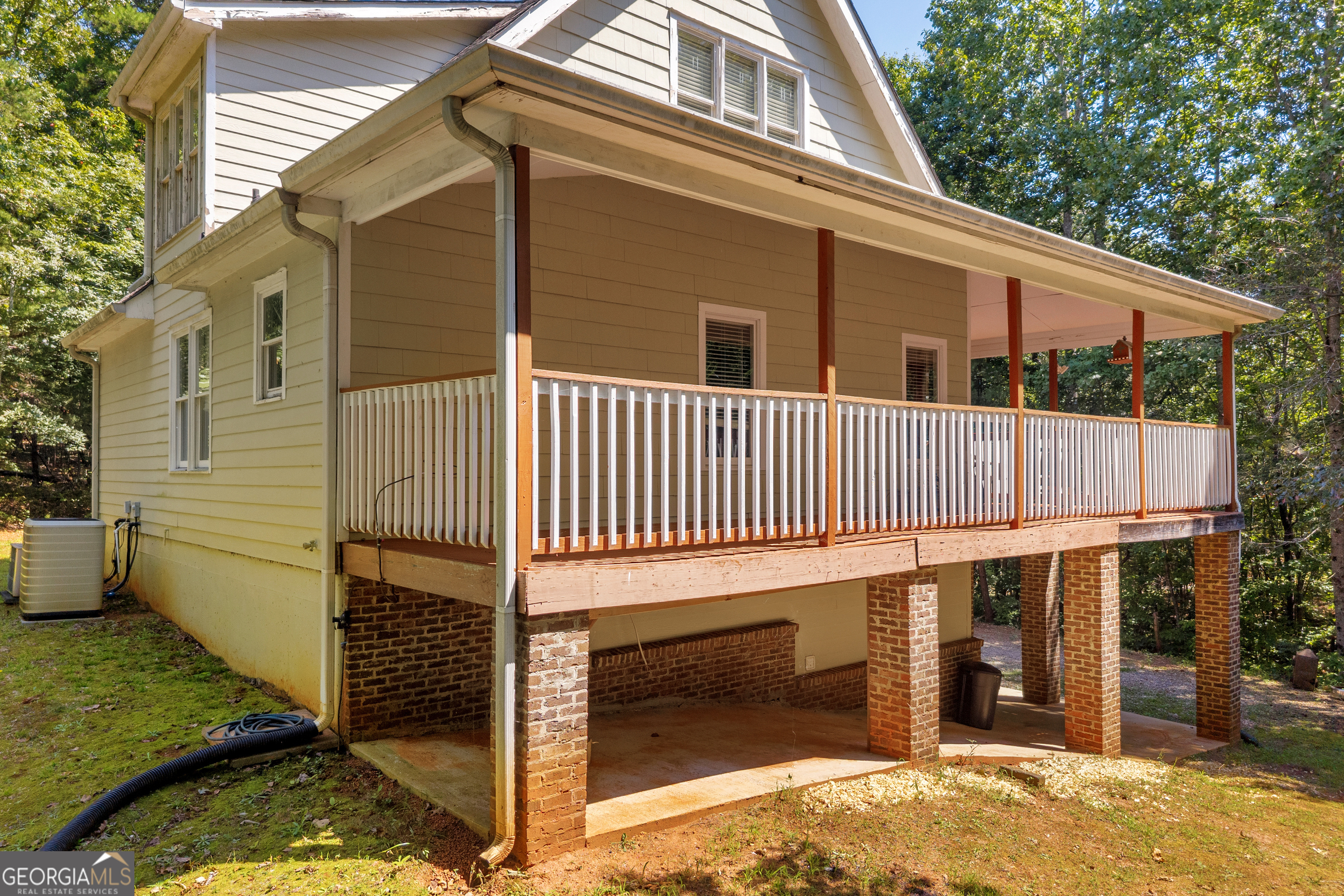 807 Satterfield Road Cleveland, GA 30528 - Photo 6 of 99 a view of a small house with wooden fence