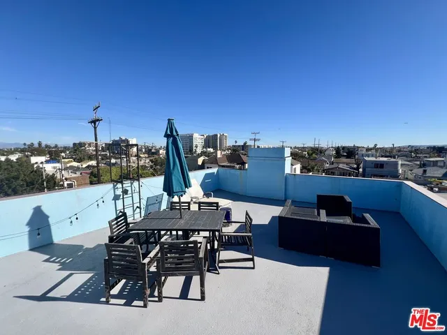 a view of a terrace with furniture and a table