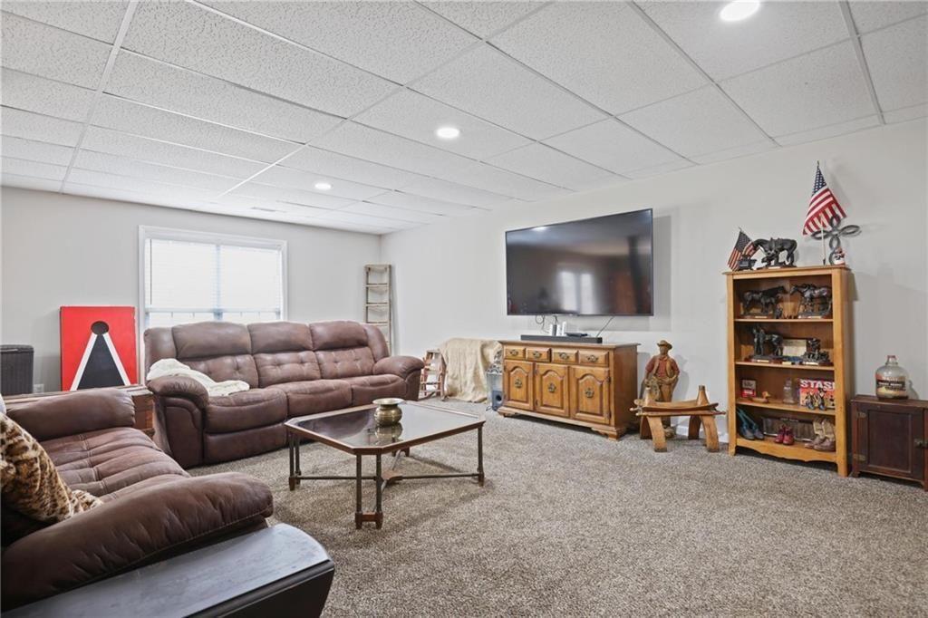 342 Miller Path Temple, GA 30179 - Photo 27 of 47 a living room with a couch and a flat screen tv