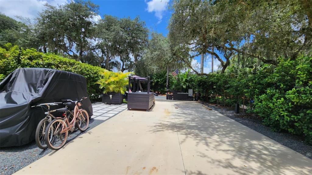 281 Foal Drive River Ranch, FL 33867 - Photo 4 of 20 a view of a patio with furniture and a garden