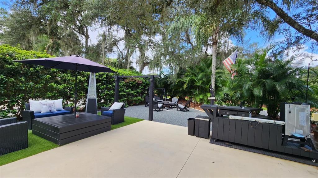281 Foal Drive River Ranch, FL 33867 - Photo 5 of 20 a view of a backyard with sitting area