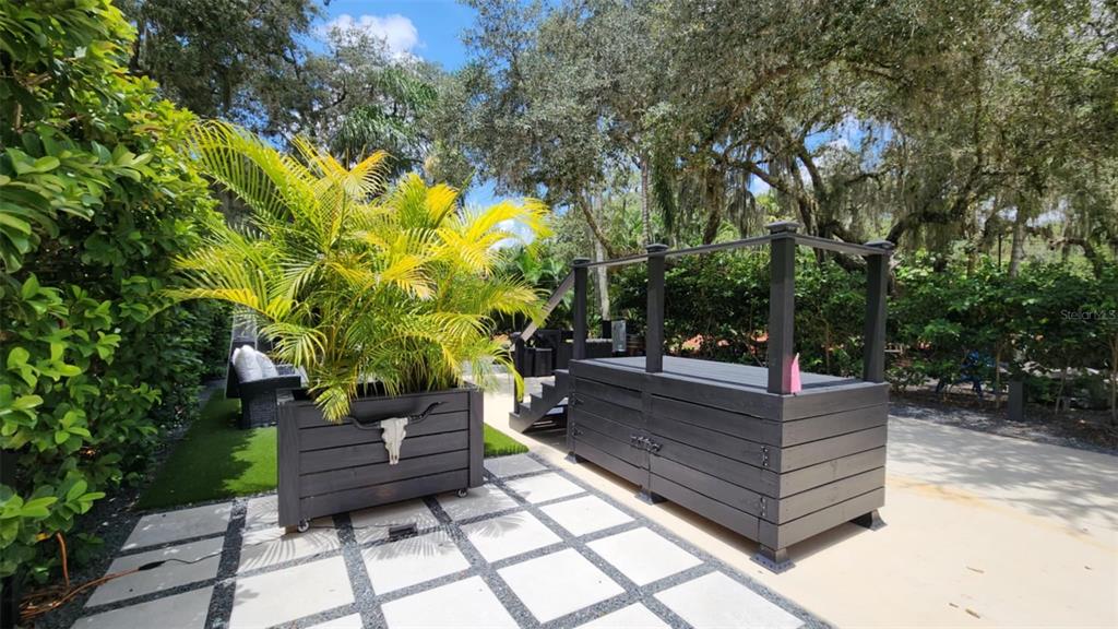 281 Foal Drive River Ranch, FL 33867 - Photo 9 of 20 a view of a bench in a garden