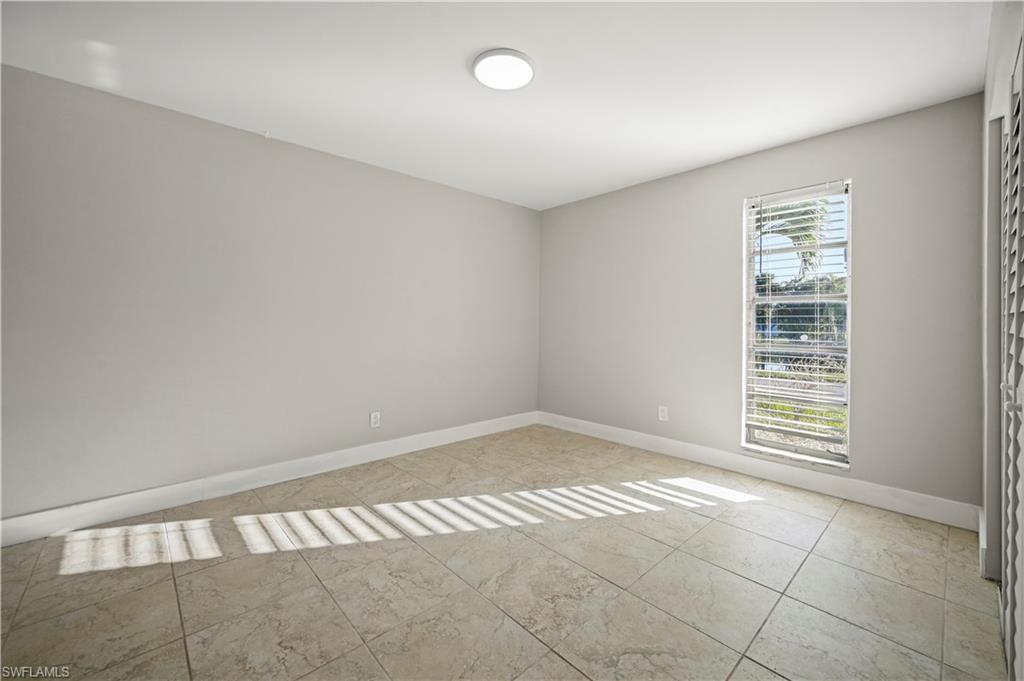3 Kings Road, Unit A7 Naples, FL 34112 - Photo 13 of 20 Spare room with baseboards