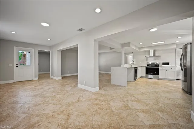 a sign that is sitting on a green field