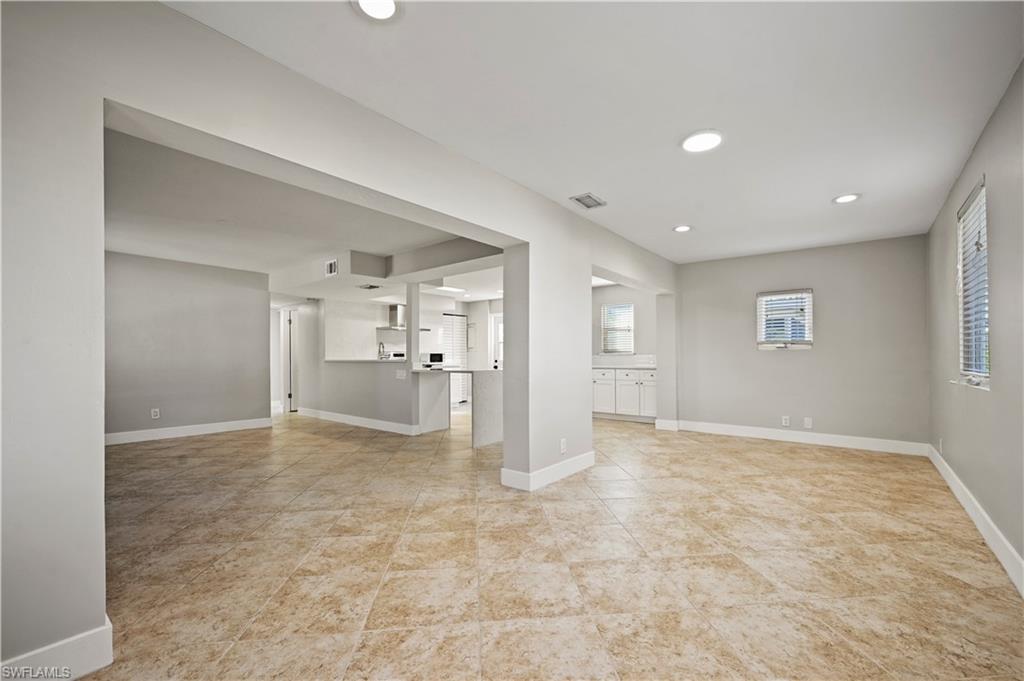 3 Kings Road, Unit A7 Naples, FL 34112 - Photo 8 of 20 Unfurnished living room featuring recessed lighting and light tile patterned floors
