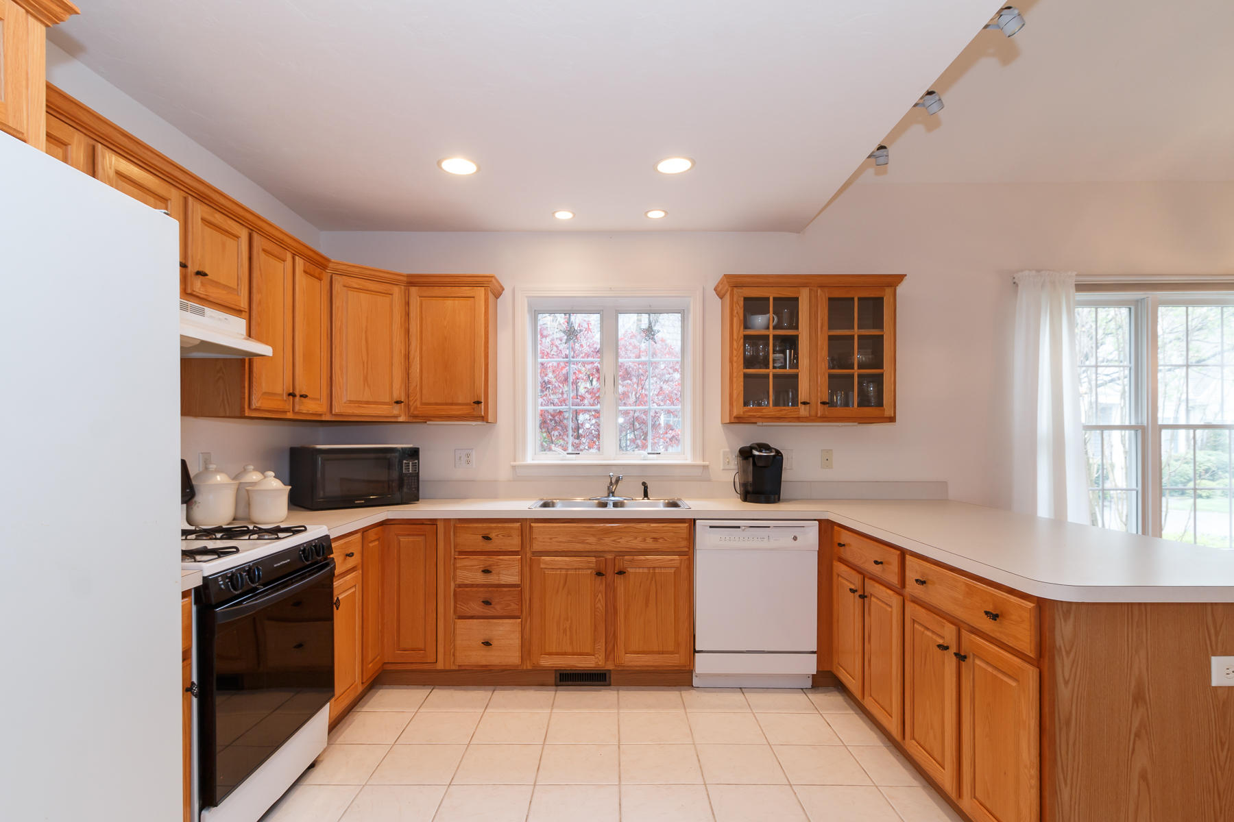 36 Windsor Point Mashpee, MA 02649 - Photo 9 of 23 a large kitchen with stainless steel appliances granite countertop a stove a sink dishwasher and a refrigerator