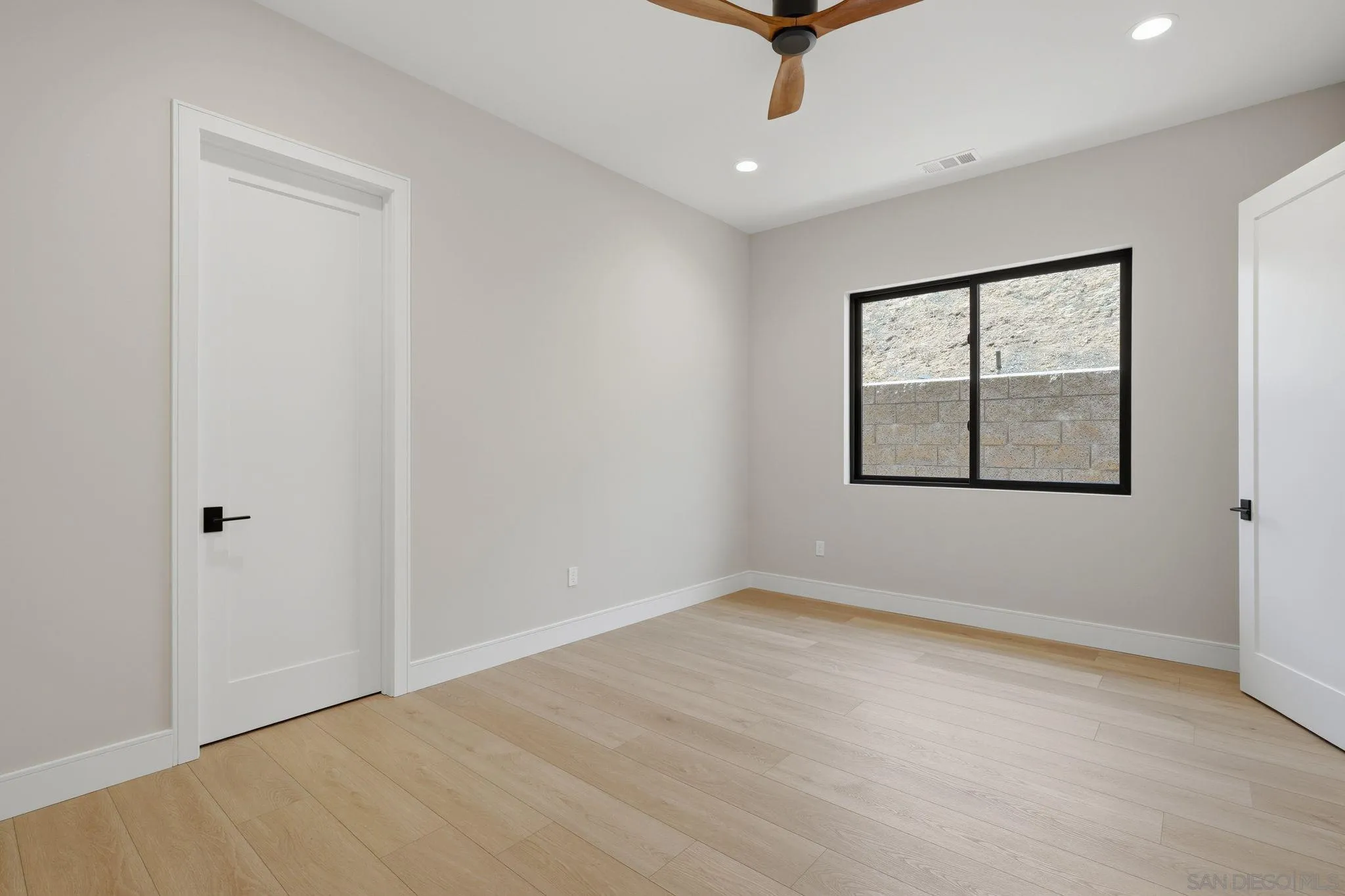 3916 Citrus Drive Fallbrook, CA 92028 - Photo 37 of 72 an empty room with windows and ceiling fan
