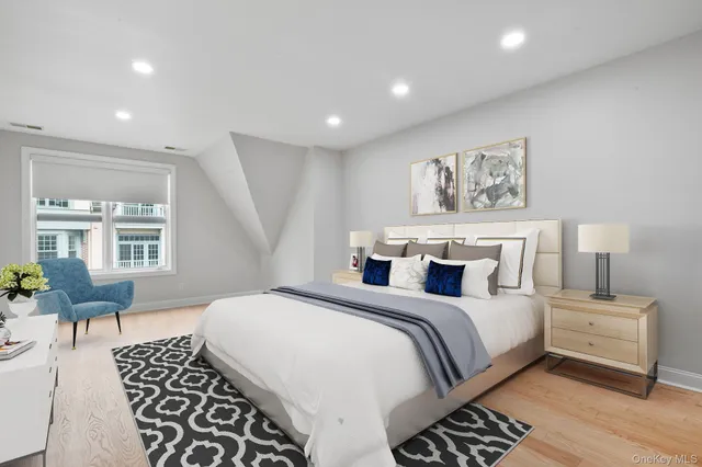 a bedroom with a large bed and a couch