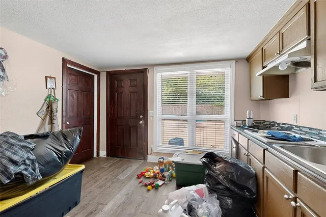 a bedroom with furniture and a window