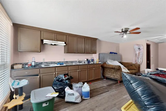 a front view of a house with sitting area