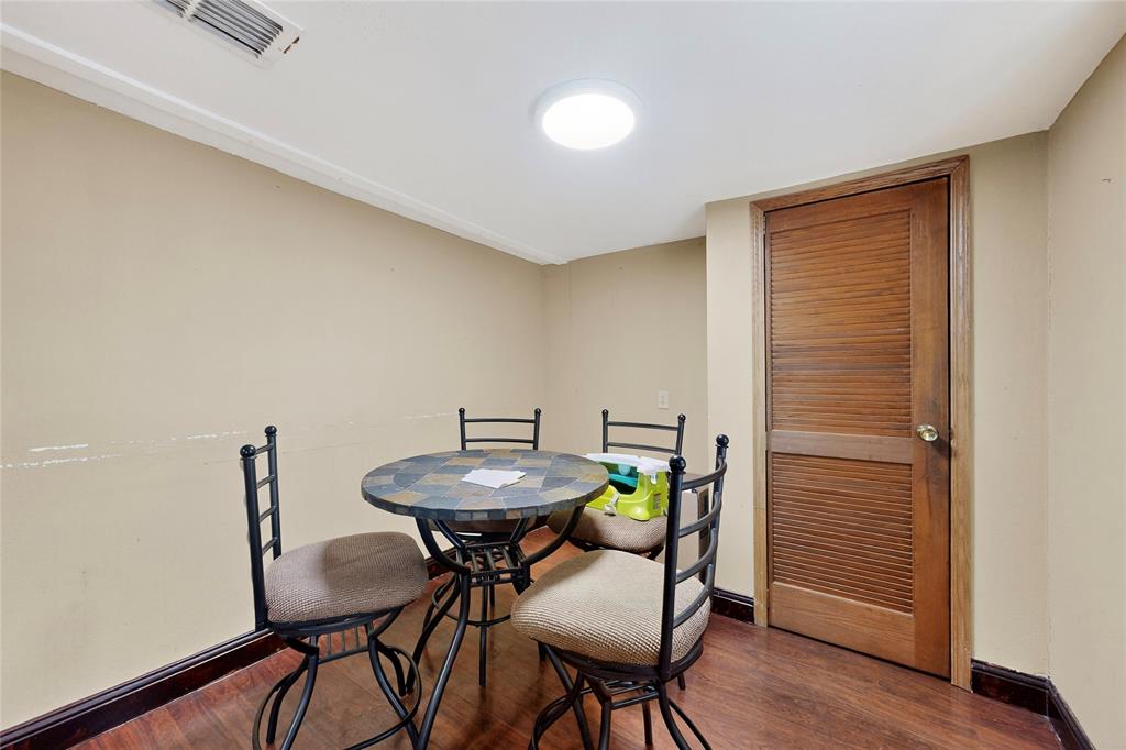 940 Rowlett Road Rowlett, TX 75088 - Photo 26 of 37 a view of a dining room with furniture and wooden floor