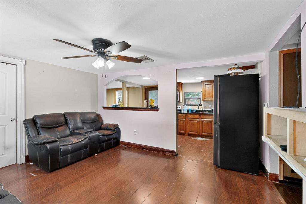 940 Rowlett Road Rowlett, TX 75088 - Photo 28 of 37 a living room with furniture and a wooden floor