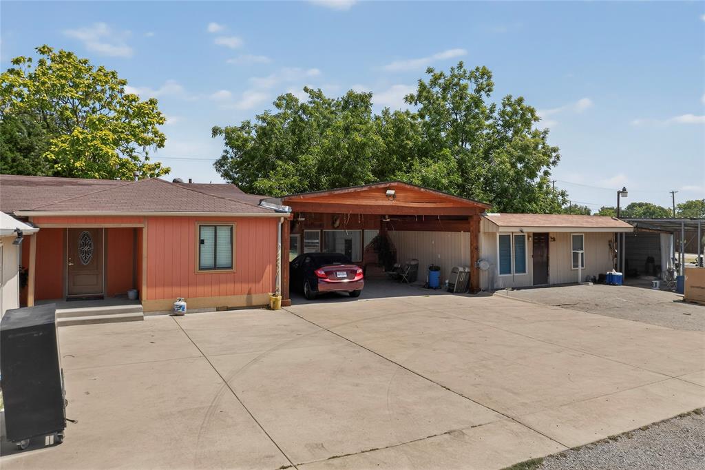940 Rowlett Road Rowlett, TX 75088 - Photo 35 of 37 a view of a house with a patio and a yard