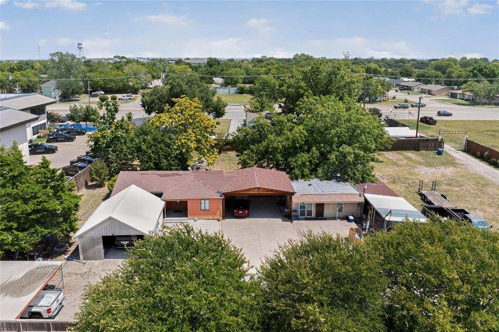 940 Rowlett Road Rowlett, TX 75088 - Photo 4 of 37 an aerial view of a house with a yard and lake view