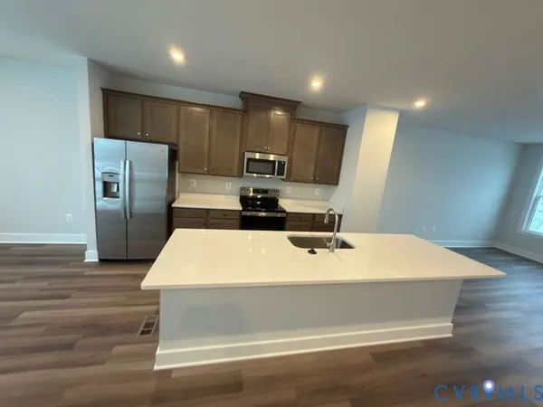 an empty room with wooden floor