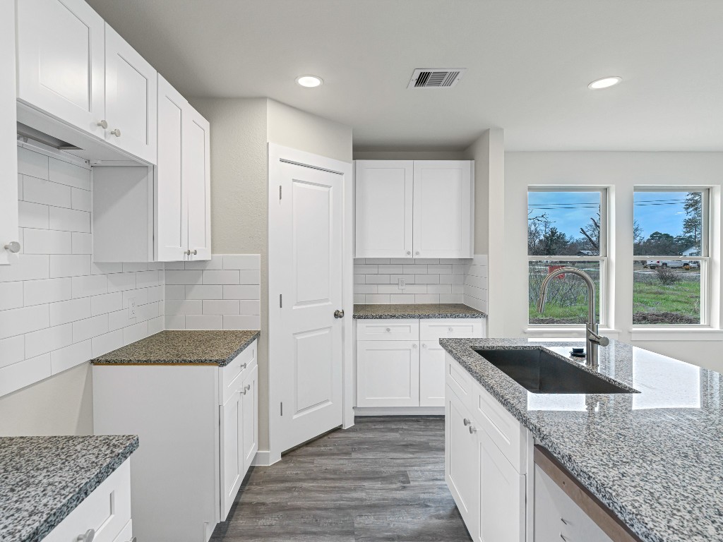 1010 4th Street Hempstead, TX 77445 - Photo 11 of 23 a kitchen that has a sink and a stove in it